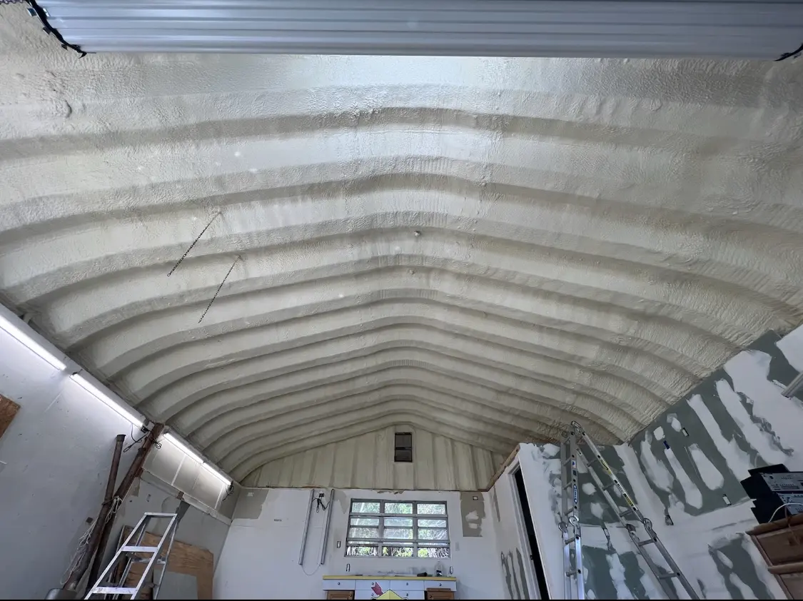 Spray polyurethane foam applied to the underside of a metal roof deck in Tamiami